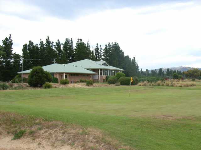 A view of hole #6 and the clubhouse in background at Llanherne Golf Club.
