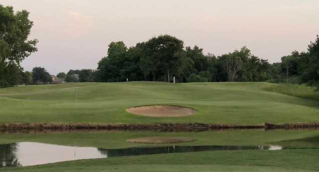 A view over the water of a hole at White Hawk Golf Club.