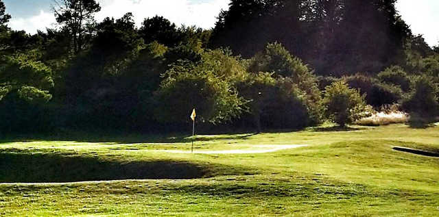 A sunny day view of a hole at Tidworth Garrison Golf Club