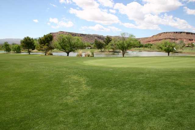 A view of a hole with water in background at Bloomington Country Club