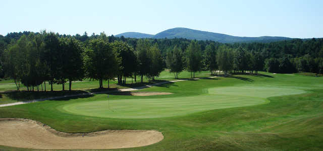 A view of a green protected by bunkers at Stonebridge Country Club.
