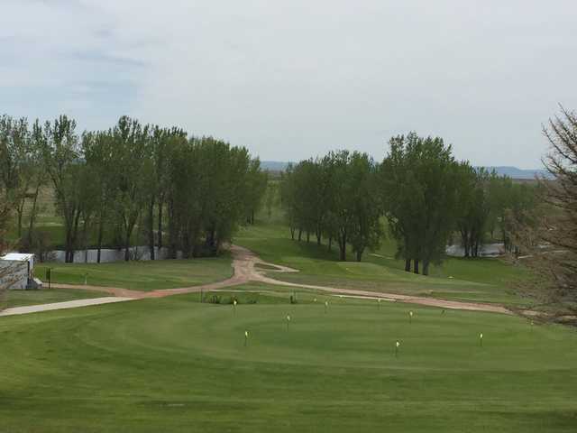 A view of the practice putting green and a tee in background at Rolling Hills Golf Course.