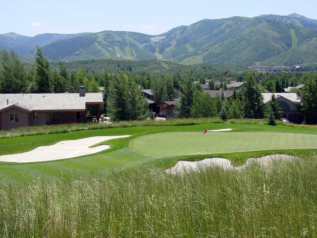 A view of a green protected by bunkers at Park Meadows Golf Club