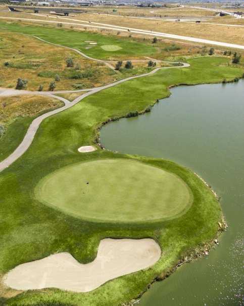 Aerial view of green surrounded by water at Wingpointe Golf Course