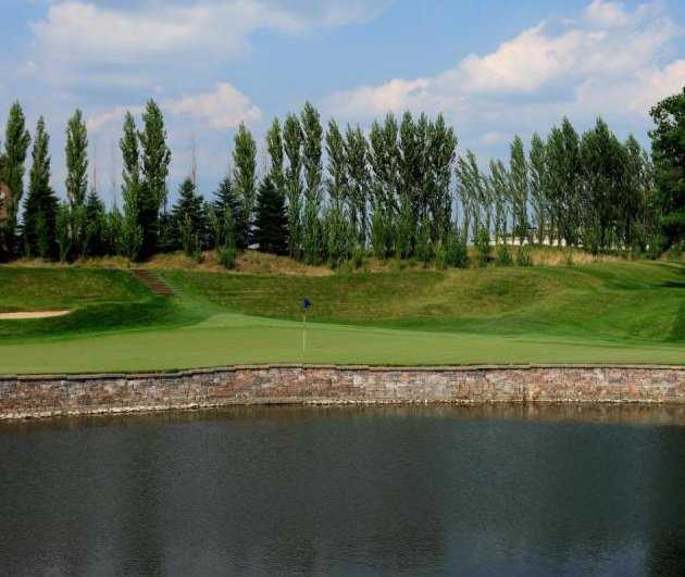 A view over the water of a green at Woodland Country Club