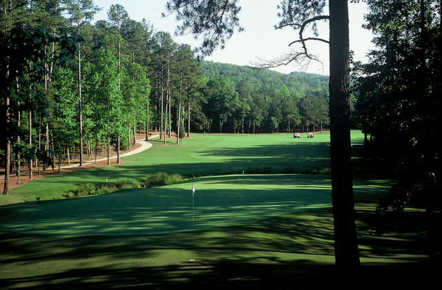 A sunny day view of a hole at Limestone Springs Golf Club.