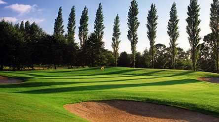 A view of a green protected by bunkers at Hermitage Golf Club