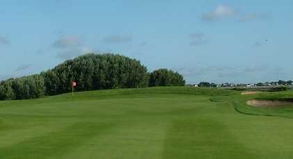 A view of a green protected by bunkers at St. Anne's Golf Club