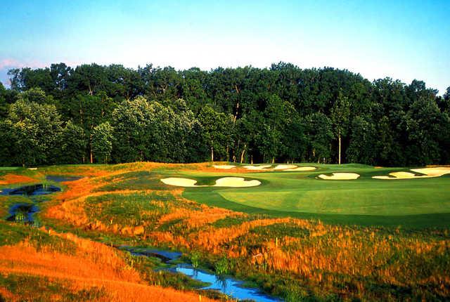 A view of a green protected by sand traps at Prairie View Golf Club