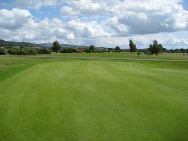 A scenic view of the 18th green at Ludlow Golf Club