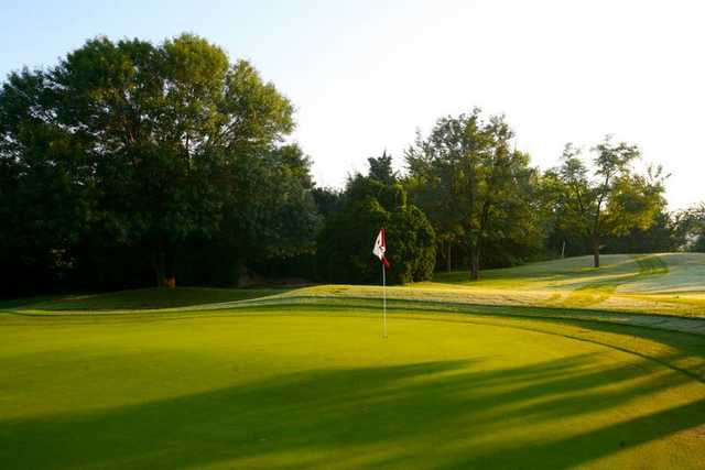 A sunny view of green at Jimmie Austin University of Oklahoma Golf Course