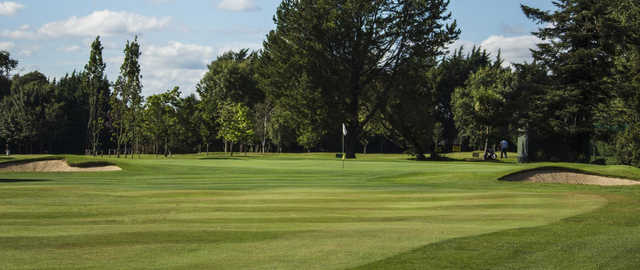 A view of a green flanked by bunkers at Foxrock Golf Club.