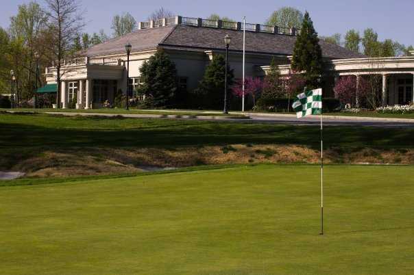 A view of a hole and the clubhouse at Deerfield Golf & Tennis Club