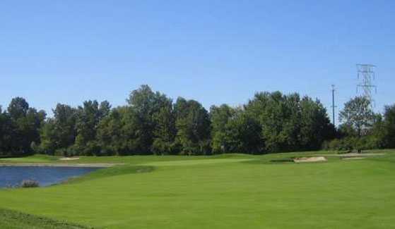 A view of a green with water coming into play from left at Saddlebrook Golf Club