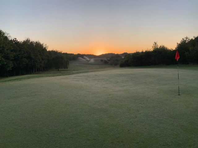 A sunrise view of a hole at Greys Green Golf Course.