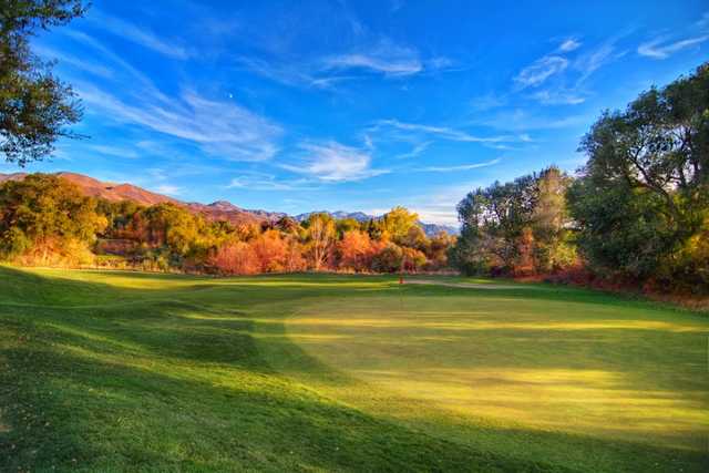 A fall day view of a green at Bonneville Golf Course.