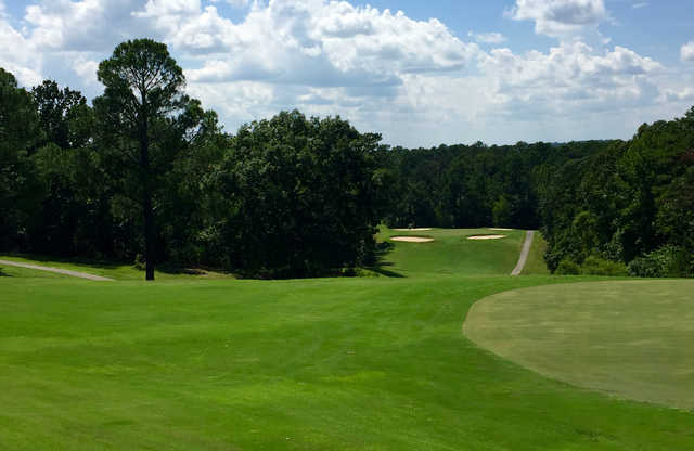 A view of a green guarded by bunkers at Cumberland Lake Golf Course.