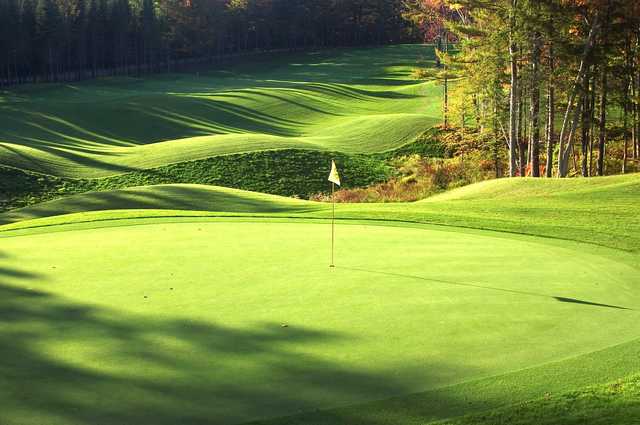 A sunny day view of a green at Montcalm Golf Club.