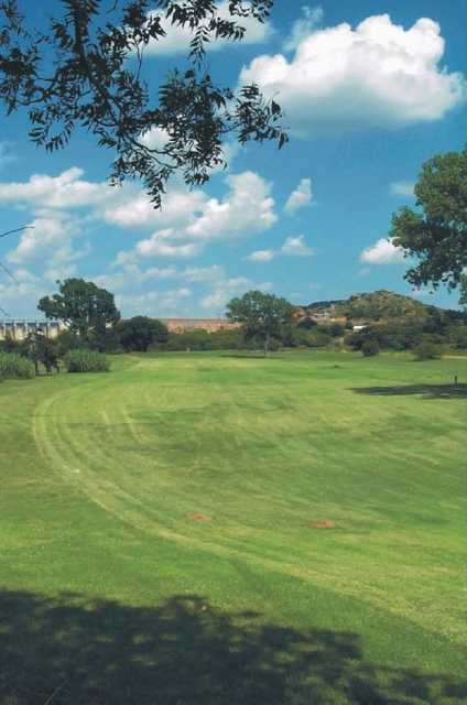 A view from the left side of a fairway at Quartz Mountain Golf Course