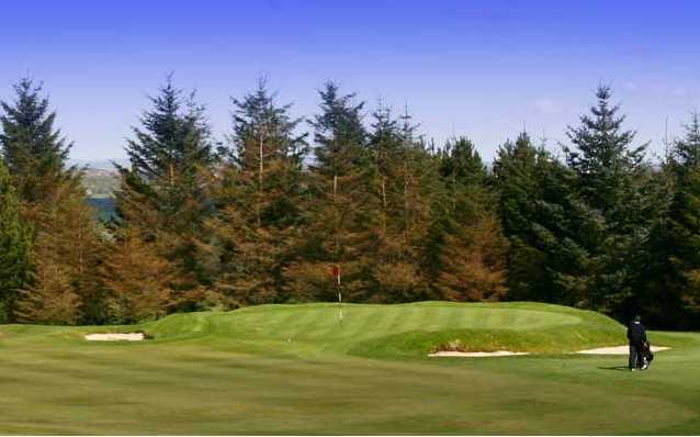 A view of green guarded by bunkers at Bonnyton Golf Club