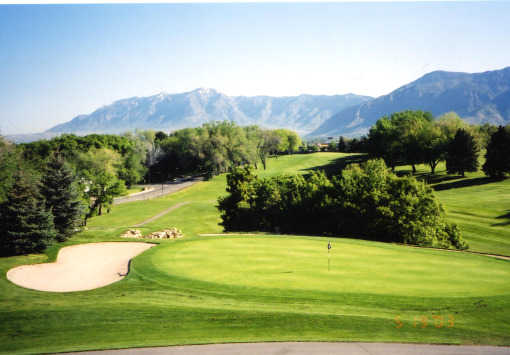 A view of green protected by sand trap at Ogden Golf & Country Club