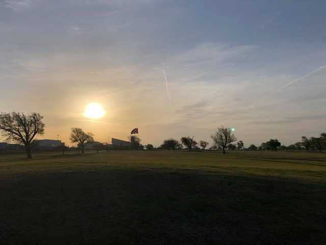 A sunset view of hole #4 from The Greens of Altus Golf Course.