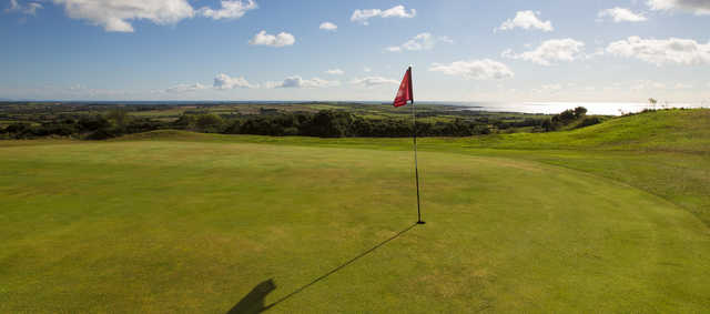 A sunny day view of a hole at Bright Castle Golf Club.