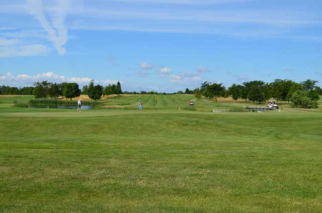 A view of a green with water coming into play at Fox Run Golf Course
