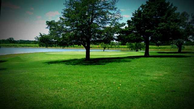 A view of a green with water coming into play at Guthrie Golf & Country Club
