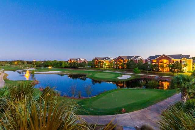 A view of a green and the practice putting area at ONE Club Golf Course.