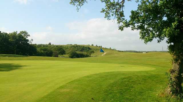 A sunny day view of a hole at Woodlands Golf & Country Club.