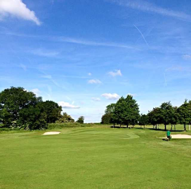 A view of the 14th green and greenside bunkers at Malkins Bank Golf Club