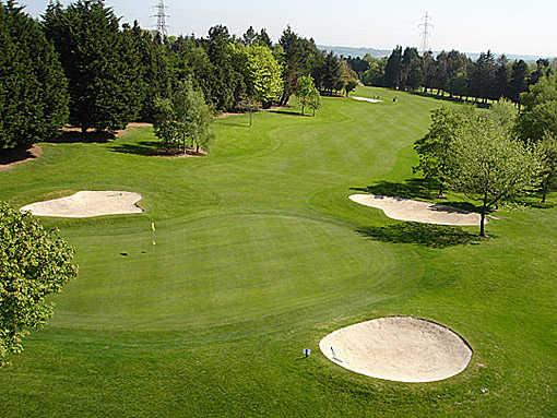 A view of the 11th green guarded by bunkers at Monkstown Golf Club