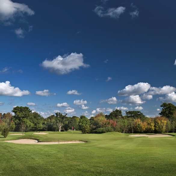 A view of the 13th green protected by bunkers at Mill Ride Golf Club