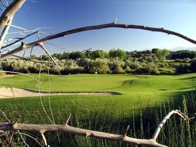 A view of a hole protected by bunker at River Oaks Golf Course