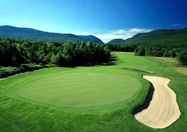 A view of a green protected by a sand trap at Mount Washington from Mount Washington Hotel & Resort.