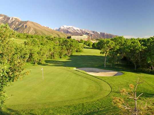 A view of green #16 protected by bunker at Old Mill Golf Club