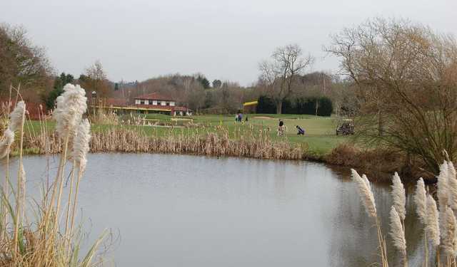 View of the Springwater Golf Club clubhouse over the lake