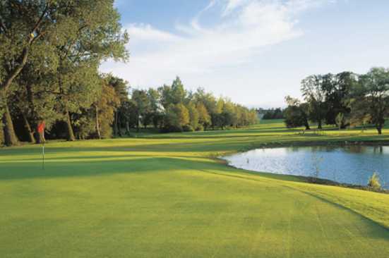 A view of a hole with water coming into play at Stapleford Park Country House Hotel & Sporting Estate