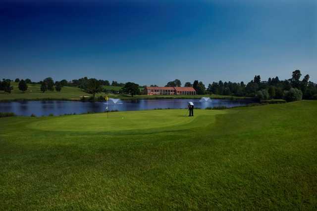 Stunning view from the 8th green overlooking the lake on the Kings Course at The Warwickshire Golf Club