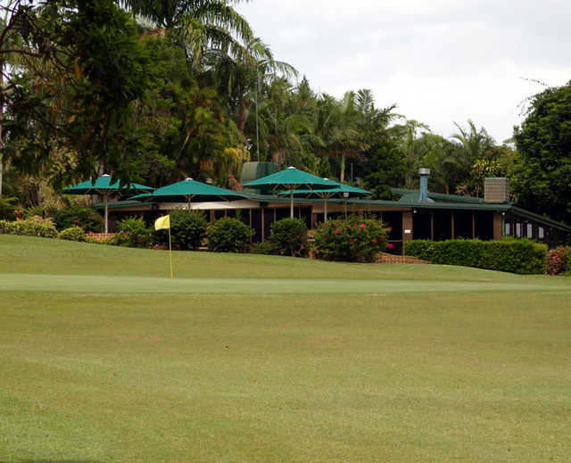 A view of green with clubhouse in background at Noosa Valley Golf Club