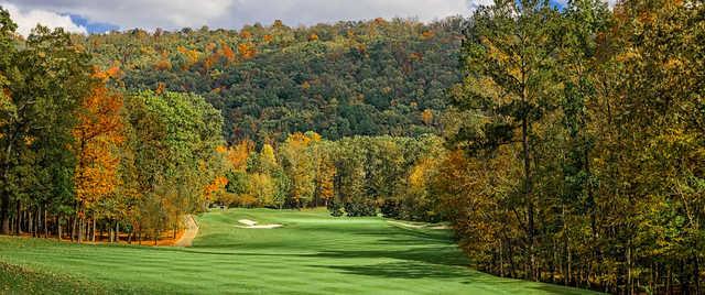 A splendid fall day view of a green flanked by bunkers at Greystone Golf & Country Club.