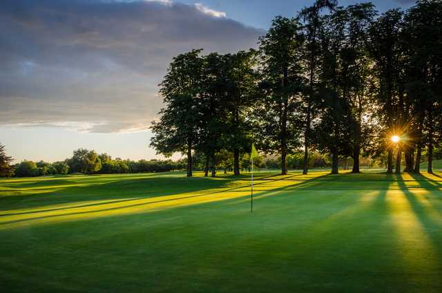 A sunny day view of a hole at Badgemore Park Golf Club.