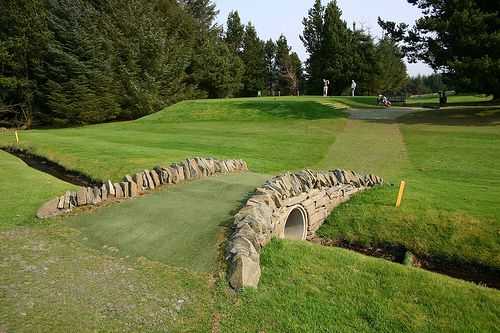 Idyllic footbridge to one of the course's tree-lined fairways