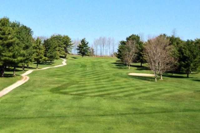 A view of a fairway with a narrow path on the left side at Ralph Myhre Golf Course