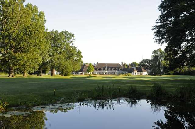 Beautiful view across the pond of the 18th green with the clubhouse in the background at Shirley Park Golf Club