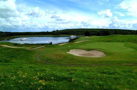 A view of a green protected by a bunker at Carrick-on-Shannon Golf Club