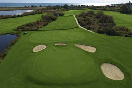 Aerial view of hole #7 surrounded by tricky bunkers at Acoaxet Club