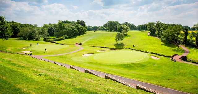 A view of two greens at Wilmslow Golf Club.
