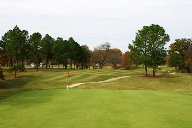 A fall day view of a hole at Muskogee Country Club